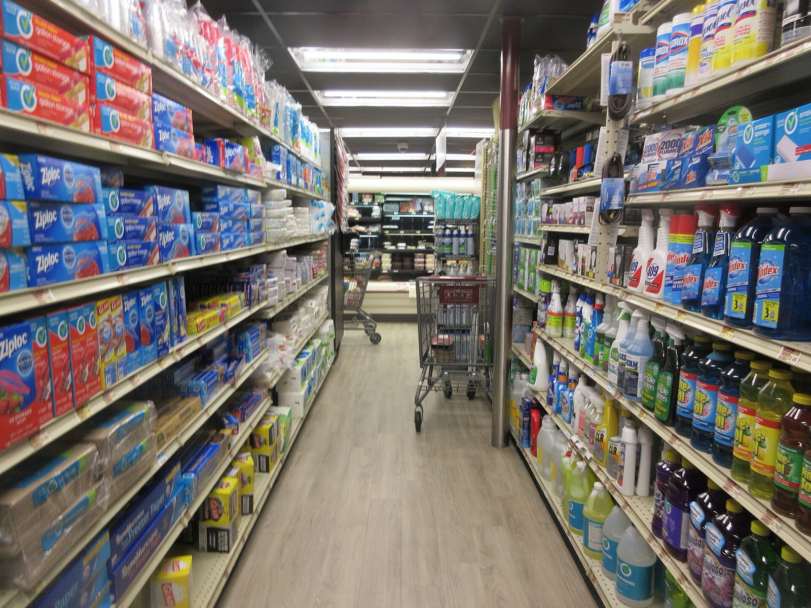 Interior aisle of a grocery store in New Orleans, with shelves of packaged food