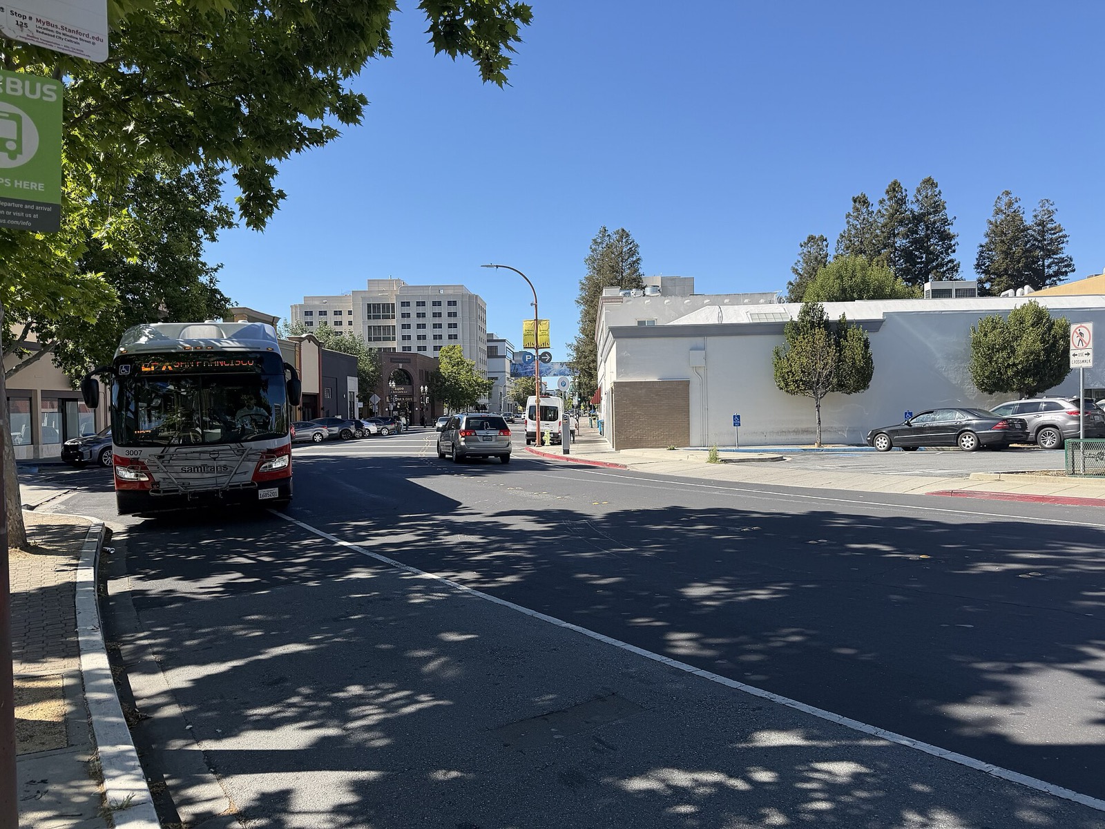 A city bus at a transit center bus stop in Redwood City, California