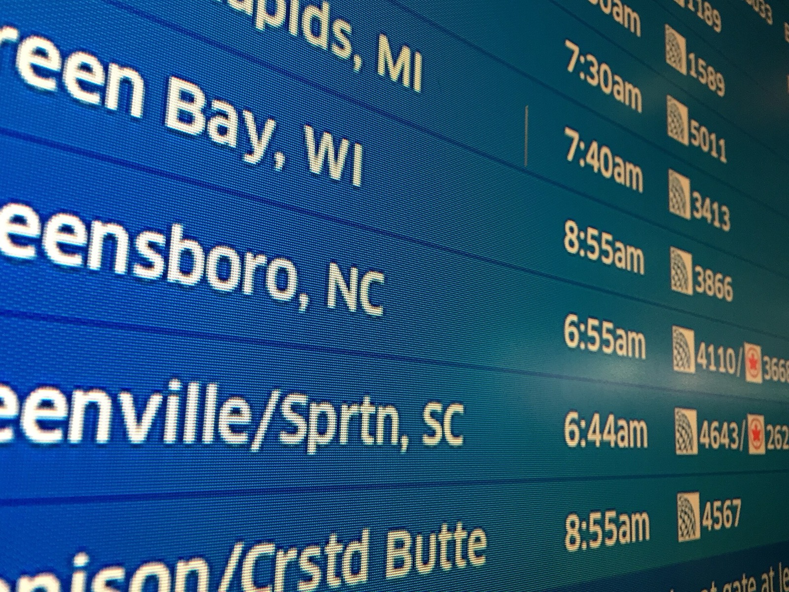 Flight departure board at Chicago O'Hare airport